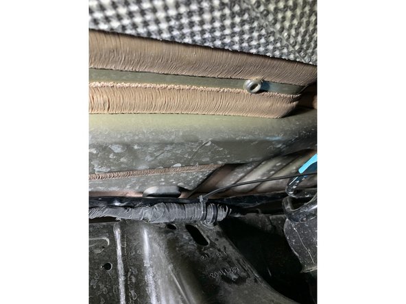 Secure the ARB power harness under the vehicle .