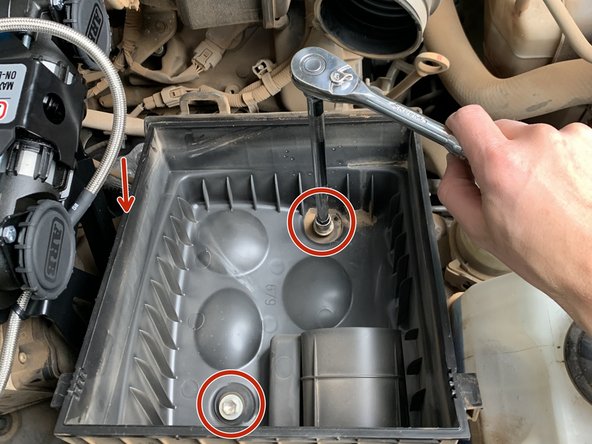 Remove the two M8 bolts inside of the airbox securing it to the inner fender with a 12mm socket/wrench.