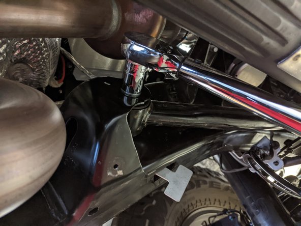 If you have trouble getting the new bolt in, a ratchet strap can be used to help pull the axle back into alignment.