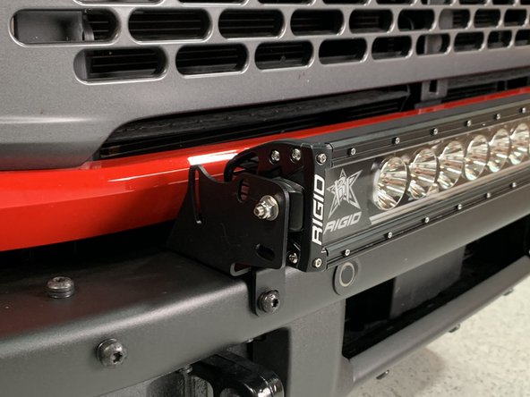 Attach the light bar to the light bar brackets.