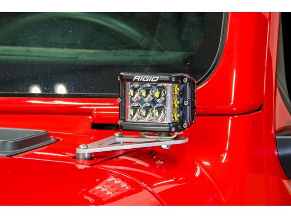 Best efforts were made to ensure compatibility with a wide variety of lights, but not all lights have been tested. A balance was struck between the height of the light bracket to minimize viewing obstruction and clearance for the light mounting hardware.