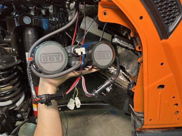 The ARB CKBLTA12 Twin Compressor comes with two wire harnesses and a power lead. The thicker harness is the main power harness and will be used to power the compressor. The other harness is the control harness and will be replaced by the included Grimm OffRoad control harness.