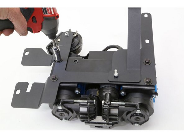 With the ARB Twin Compressor upside down, set the compressor bracket assembly onto the compressor and install using the ARB supplied mounting screws.