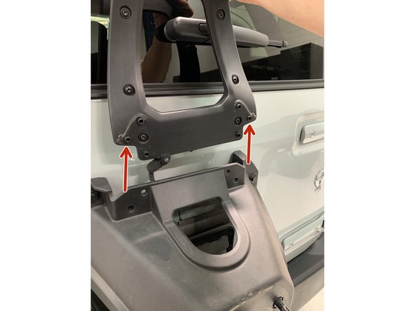 Note that the 3rd brake light bracket's screw holes key into the spare tire mounting bracket.