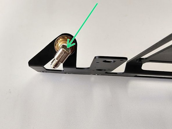Install the 1/4” NPT x JIC4 90° elbow into the back of the bulkhead fitting on the controls plate using a 14mm wrench. Use thread sealant on the NPT threads and match the alignment of the fitting to the picture.