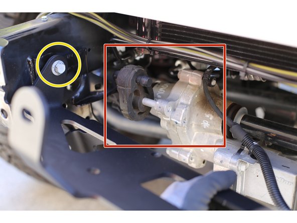 Orient the Grimm OffRoad Winch Plate in between the frame rails as shown and temporarily secure with a factory bolt removed in the previous step threaded through a upper ear into the side of the frame.