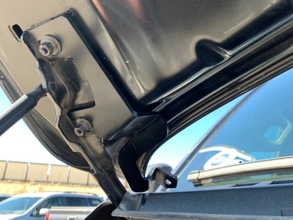 There is a left and right hood hinge light bracket. Make sure you have the correct bracket for the side you are installing. The brackets install from the center of the vehicle out, with the slots sliding over the hood studs as shown.