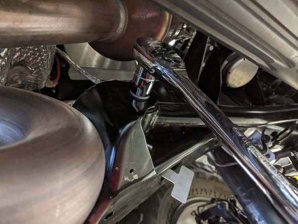 The stock bolts for the front upper control arms use an 18mm wrench/socket.