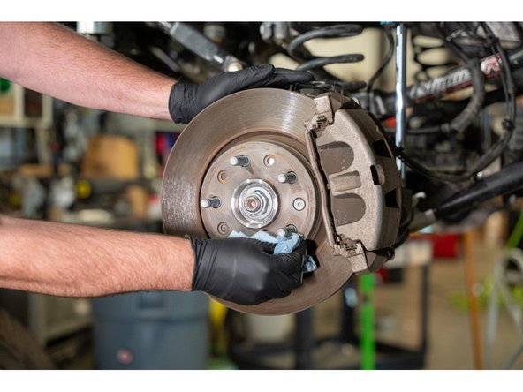 Wipe with a clean shop towel.