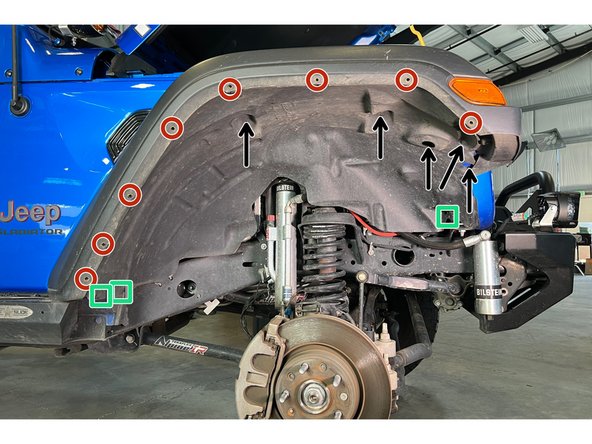 Remove the five fender liner screws with a 10mm socket/wrench (arrows in image). Save these as they will need to be reinstalled later.