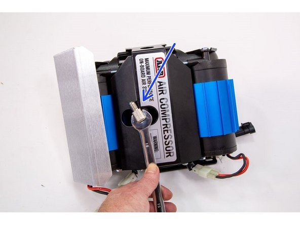 Install the 1/4” NPT x JIC4 90° fitting into the outlet post of the ARB compressor. Make sure to use thread sealant on the NPT thread and orient the fitting as shown.