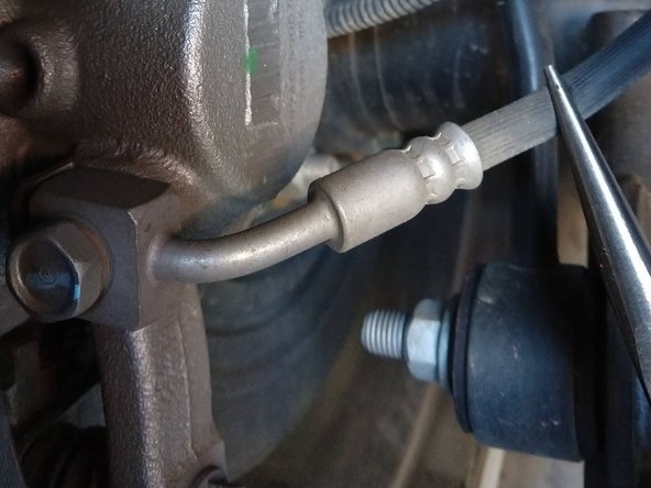 We recommend pinching off the factory brake hose close to the caliper with a pair of hose pinch off pliers. If these are not available, a pair of needle nose Vice Grip pliers, or a pair of conventional needle nose pliers with a zip tie around the handles can work.