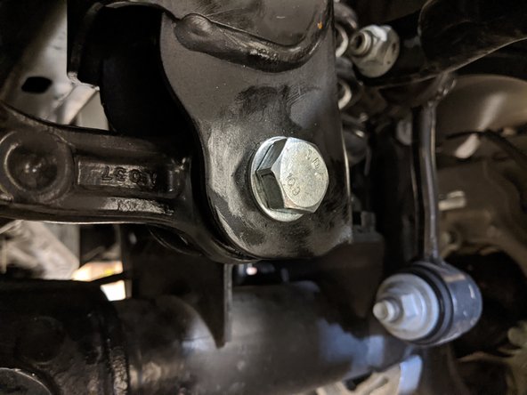 Make sure to hold onto the track bar so it doesn't drop out of the bracket.