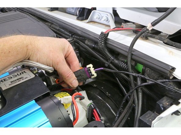 From the switch harness, connect the plug with the purple and black wire into the smaller compressor plug. This is the compressor activation circuit.