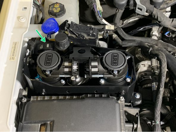 Toggle the compressor switch to the on position. The compressor should turn on for a short period of time then turn off.