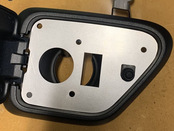 The base plate will cover the section that was cut out, and make sure enough material was removed for the air coupling and switch holes to be clear.
