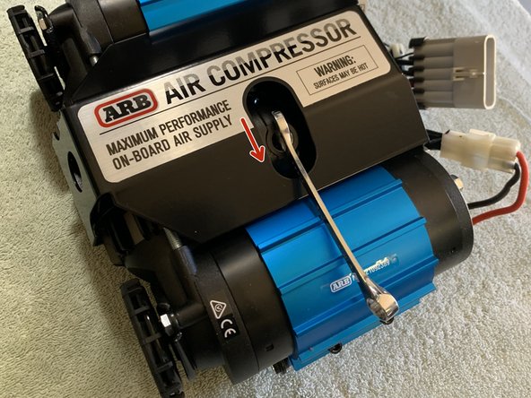 To optimize air line route, loosen manifold cap with 10mm box end wrench  and rotate housing 15deg. Once adjusted, tighten manifold cap to approximately 7 lb-ft (9 Nm)