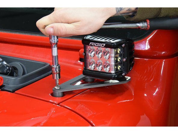 Mock up the lights and brackets to verify the light hardware does not protrude far enough to contact the cowl. If so, the light mounting hardware may need to be trimmed or spaced to prevent interference.