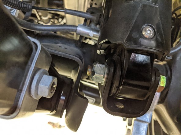 The lower eyelet of the shock will need to be supported before removing the shock bolt to prevent the shock from extending and coming out of the mount. With Nitrogen charged shocks it can be very difficult to get the shock back into the mount.