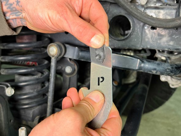 Install a clip barrel nut onto the &quot;P&quot; front mounting bracket as shown.