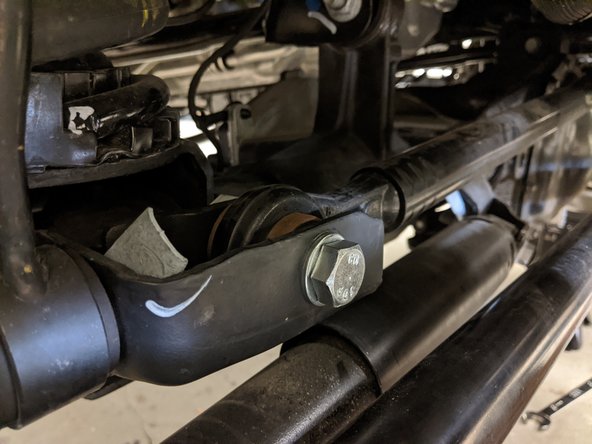Move onto the front axle side track bar mount