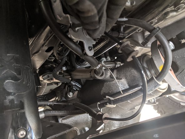 Unclip the wheel sensor wire from two clips on the brake line.