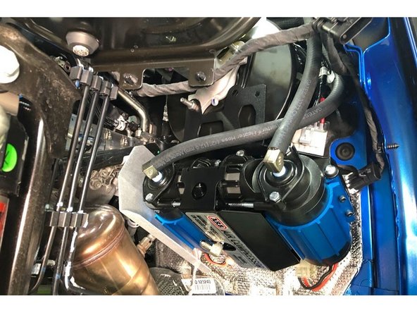 Install the supplied filter relocation hoses onto the barb fittings on the compressor. The longer of the two hoses connect to the innermost fitting, the shorter connects to the outer fitting.