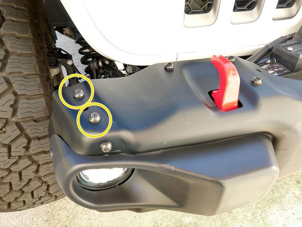 After identifying the left and right brackets, use a T45 torx driver to remove the 2 factory bolts on the top of the bumper, as shown. The bumper shown has had the outer 'wings' removed. Installation is the same if the wings are still in place.
