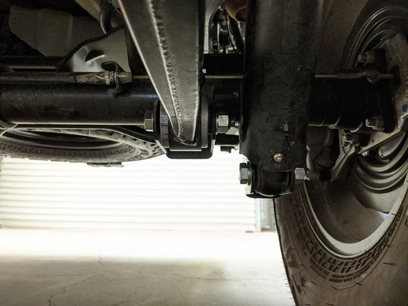 Remove one bolt at a time and replace with an M16-1.5 x 100mm bolt and lock nut with washers under the head of the bolt and lock nut.