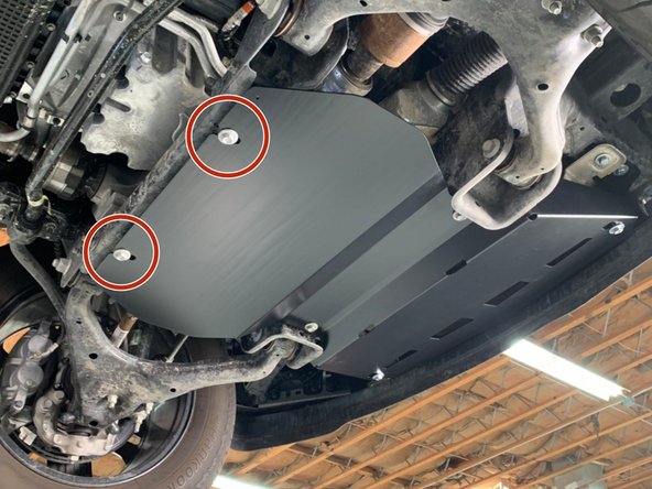 Make sure either the factory clip nuts or provided M10 clip nuts are present in the  crossmember directly behind the front differential.