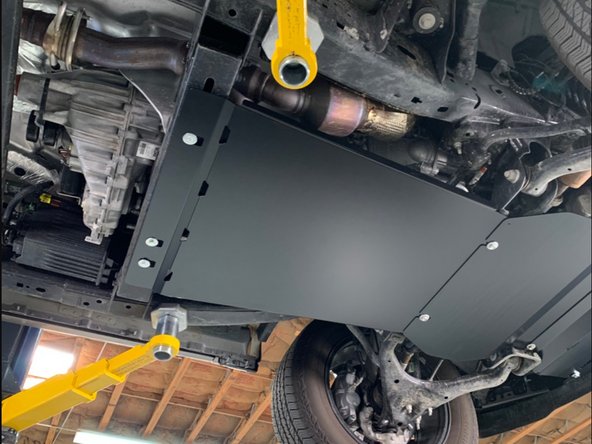 Verify the skidplate is correctly positioned, and then tighten hardware.