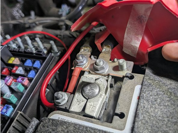 Attach the ARB provided fused lead to the positive battery terminal as shown.