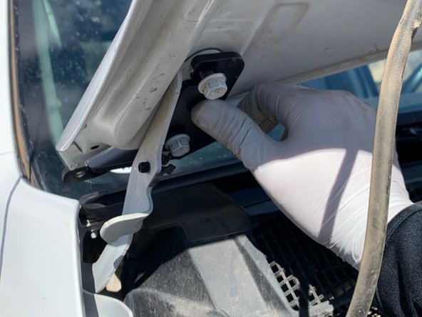 There is a left and right hood hinge light bracket. Make sure you have the correct bracket for the side you are installing. The brackets install from the center of the vehicle out, with the slots sliding over the hood bolts as shown.