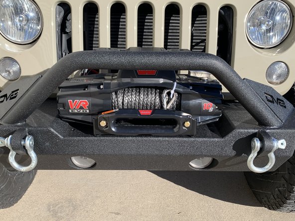Set the winch on top of the Fairlead Mounting Plate.