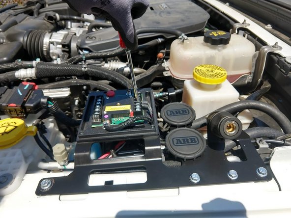 (CKMTA12 compressor only) - Run the Grimm OffRoad supplied compressor switch wire harness up through the gasket and connect to switch number of choice on the sPOD module. Black wire to GND, purple wire to SW.
