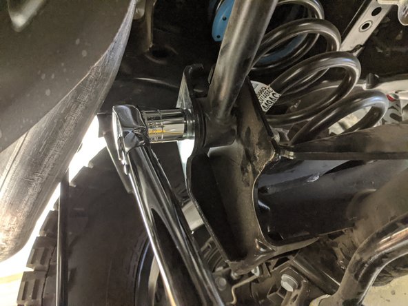 Move onto the rear axle side track bar mount