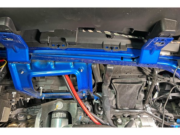 After trimming the plastic away, remove the fender flare clips.