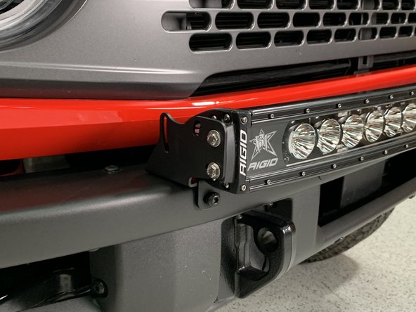 Attach the light bar to the light bar brackets.