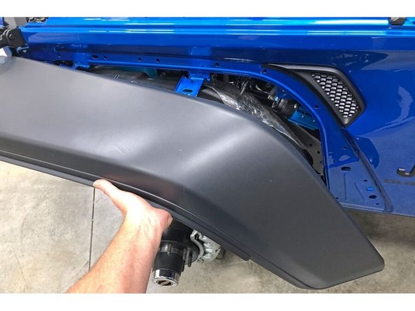 Re-install fender flare, replacing any retaining clips broken during removal.