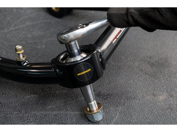 Place the domed top cap on top of the uniball and hand thread in a 12 point 1/2-20 cap screw.