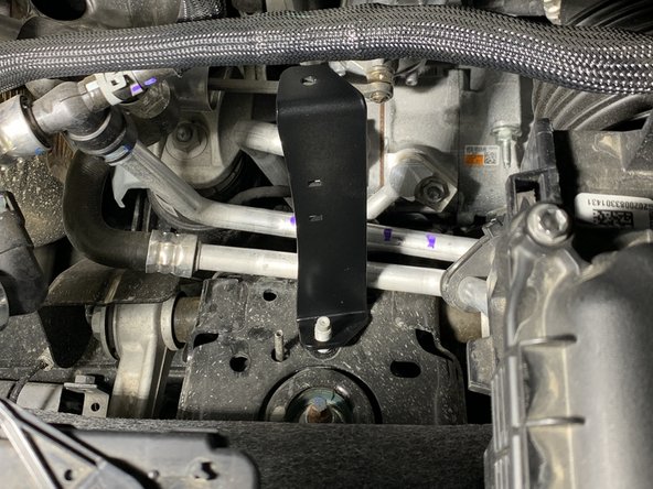 Use a 15mm socket/wrench to torque the nut to 51 lb-ft [64 Nm].