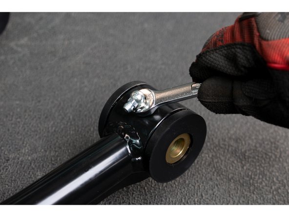 Apply grease to the inside and outside of the Hat Bushings, and slide them into the upper control arm pivot tubes.