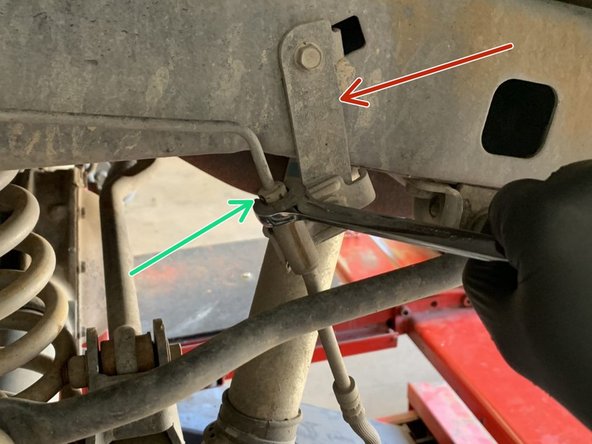 The installation instructions show an aftermarket brake line relocation bracket. Installation is the same with or without the brackets.