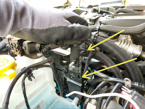 The 3.6 V6 engine needs to have a wiring harness moved before installing the controls plate. Skip to Step 20 if you are installing on the 2.0L engine.