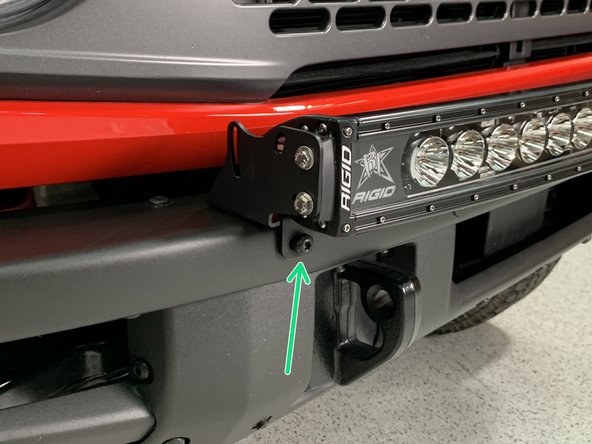 Install the light bar mounting brackets with the screws removed in the last step, but leave loose for now.