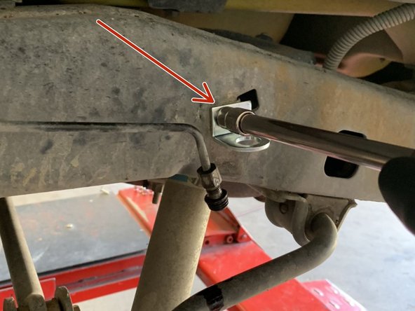 Install a new Grimm OffRoad bracket in place of the stock bracket. Re-use the factory bolt.  Position the bracket so that is is parallel to the ground and perpendicular to the hard line. Tighten the bolt with a 10mm wrench/socket.