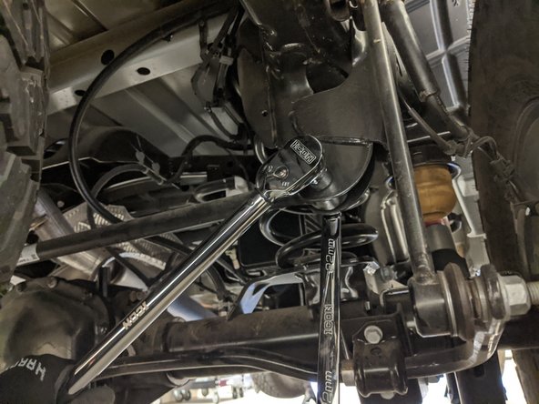 Make sure to hold onto the track bar so it doesn't drop out of the bracket.