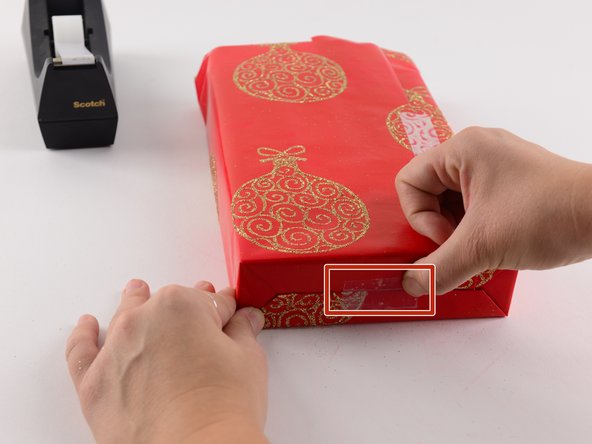 Use a single piece of tape to secure this two-sided fold.