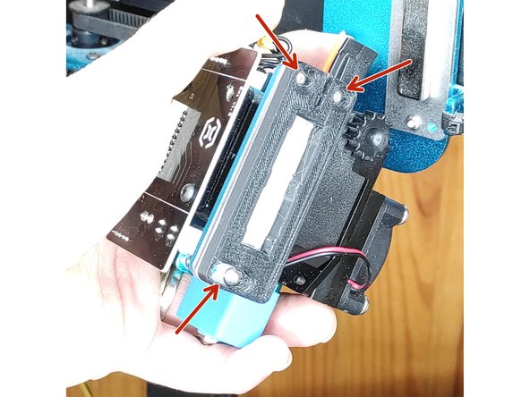 Placer le support sur l'extrudeur et engager les 3 vis (M3x12 mm)