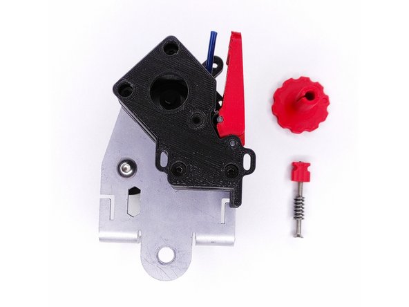 Inserez la vis M3x40 mm + le ressort dans la pièce.